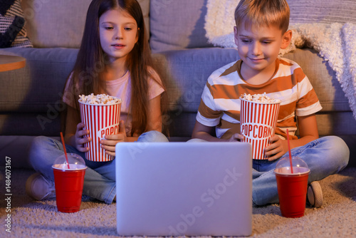 Little children with popcor...