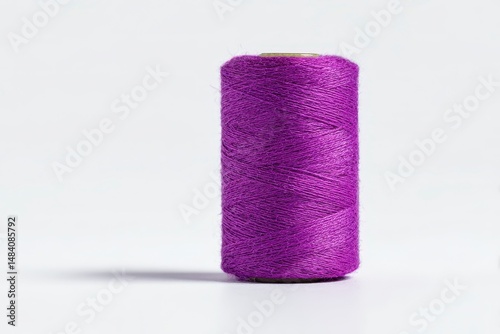 Obraz na płótnie Spool of violet sewing thread isolated on white w salonie