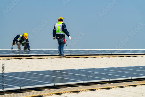 Wallpaper Mural team of professionals installs solar panels, ensuring energy efficiency and sustainable development. The image represents green energy, eco-conscious solutions, and future solar power technology. Torontodigital.ca