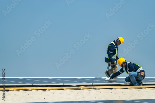 Wallpaper Mural team of professionals installs solar panels, ensuring energy efficiency and sustainable development. The image represents green energy, eco-conscious solutions, and future solar power technology. Torontodigital.ca