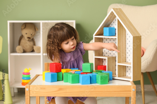 Curious toddler girl playin...