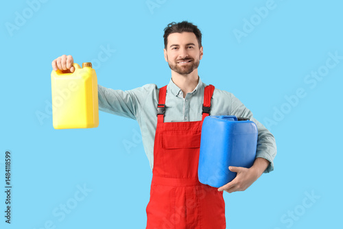 Male mechanic with canister...