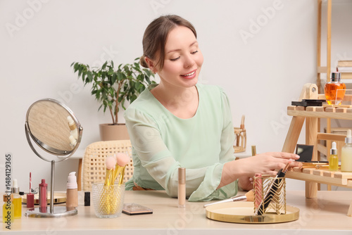 Young woman taking decorati...