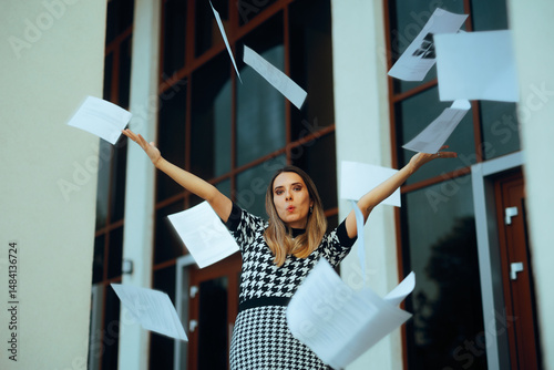 Office Worker Throwing Paperwork Quitting her Job. Lady happy to get rid of her job then throws all the papers in the air 

