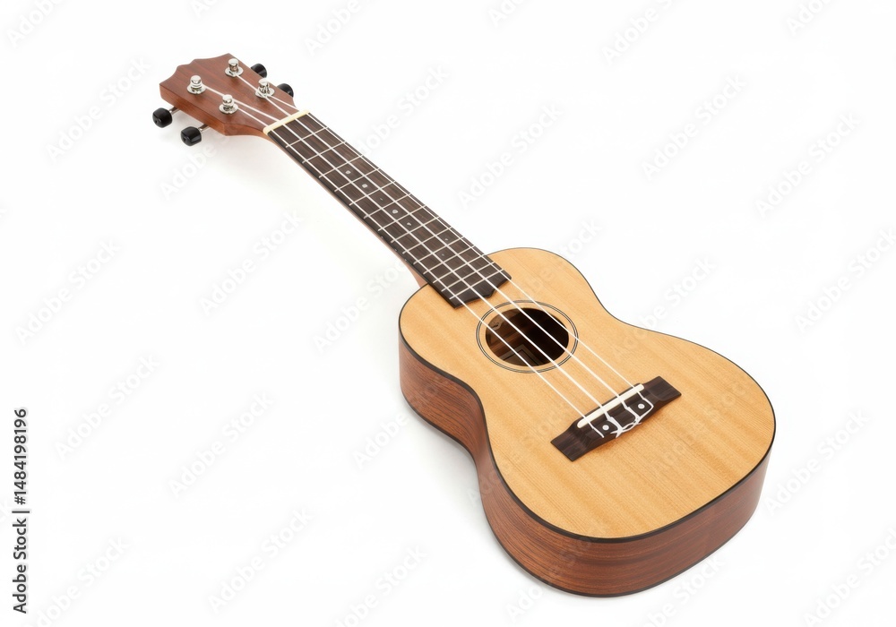 Fototapeta premium A light brown ukulele with four strings lying on a bright background plane