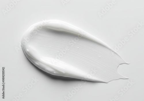 Close-up of a white cream smear on a neutral background