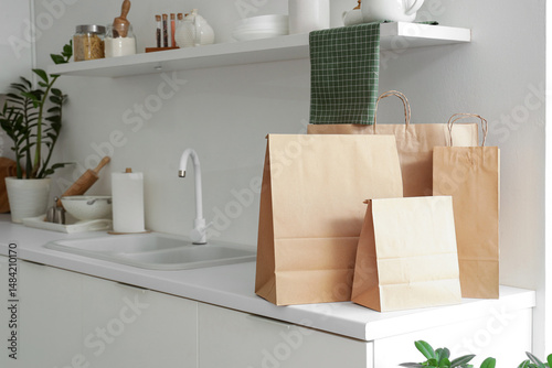 Paper bags on counter in ki...