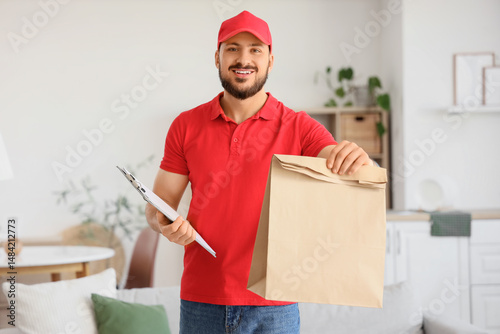 Male courier with paper bag...