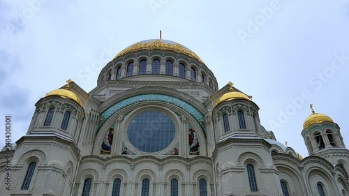 KRONSTADT, Russia - September 14, 2024: St. Nicholas Naval Cathedral. The Kronstadt Naval Cathedral on Yakornaya Square in cloudy weather in autumn. Autumn Kronstadt. Kotlin Island. 4K photo