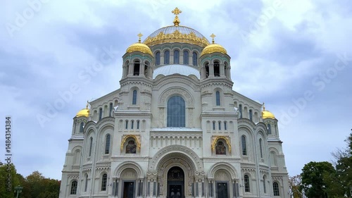 KRONSTADT, Russia - September 14, 2024: St. Nicholas Naval Cathedral. The Kronstadt Naval Cathedral on Yakornaya Square in cloudy weather in autumn. Autumn Kronstadt. Kotlin Island. 4K photo