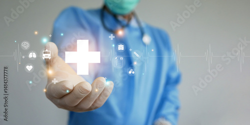 Healthcare and health insurance concept. A doctor with his hand holding health cross symbol with icons