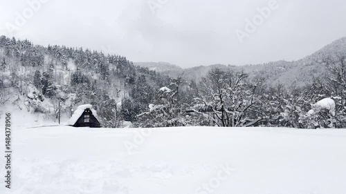 Traditional Gassho-zukuri houses covered in snow during winter in Shirakawa-go village, Japan, UNESCO World Heritage site