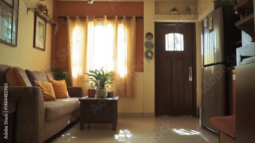Indoor shot of a modest but inviting Filipino living room in a class C housing development, decorated with a mother's personal touch and showing the front door to the right.