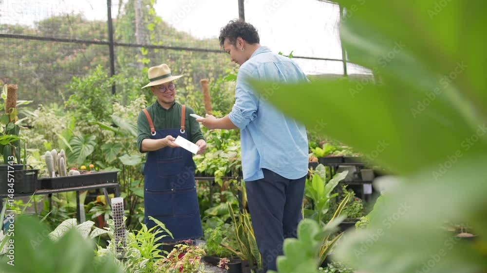 Small business entrepreneur, customer shopping with QR code payment at botanical store market. Asian man using smartphone with mobile banking app making online payment buy houseplant at plant shop.