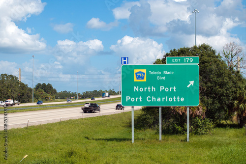 Interstate freeway exit sign in Florida, USA. I-75 highway interchange with direction to North Port and Port Charlotte