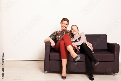 Portrait of mother and daughter 10 years old smiling