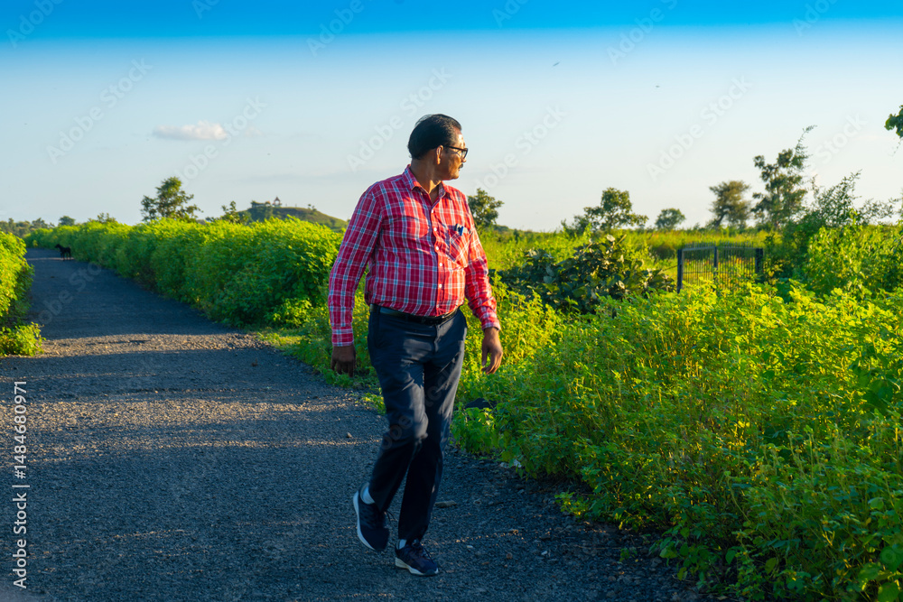 Fototapeta premium Man walking on forest road