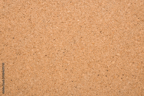 Light brown cork board background. Closeup. Empty place for text. Top down view.