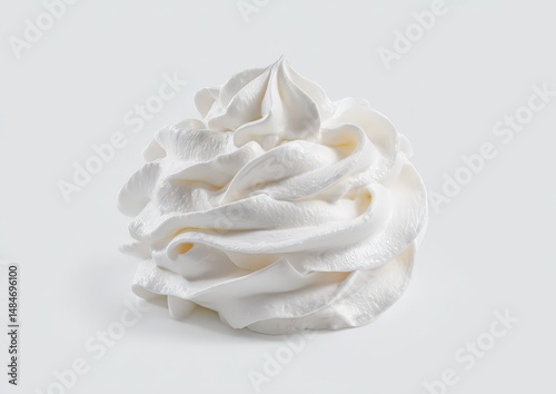Creamy white whipped cream swirl against a plain background.