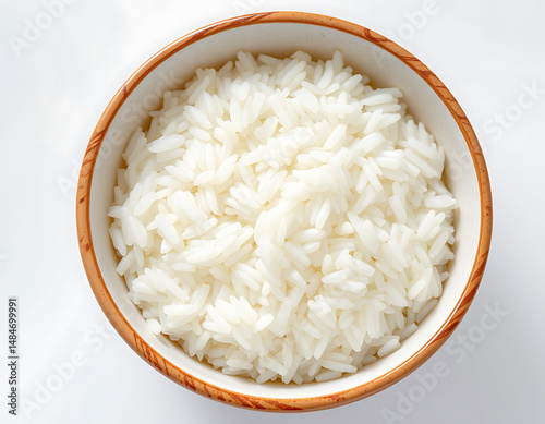 bowl of fluffy cooked white rice top view, staple food asian cuisine ingredient