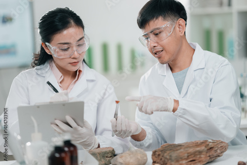 Obraz na płótnie Geological researcher classifying rock and mineral samples in laboratory setting