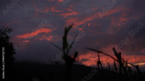 Majestic cloudy orange sunset in the mountains of Costa Rica, beautiful landscape