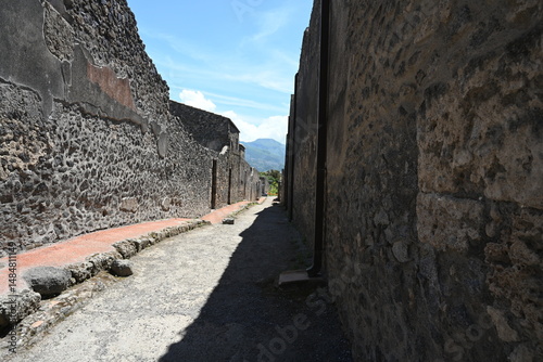 Fototapeta Naklejka Na Ścianę i Meble -  Historic streets of Ancient  roman city of Pompeii Italy on the shadow of Mt Vesuvius.Roman world, UNESCO World Heritage Site, Pompeii Archaeological Park. Italy