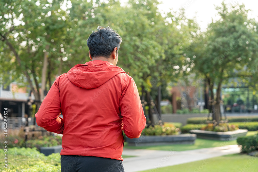 Naklejka premium Senior old man runner exercise outdoor nature park. fitness man jogging wearing sportswear. Mature athlete man in sportswear Workout running at public park. Health and activity old man lifestyle