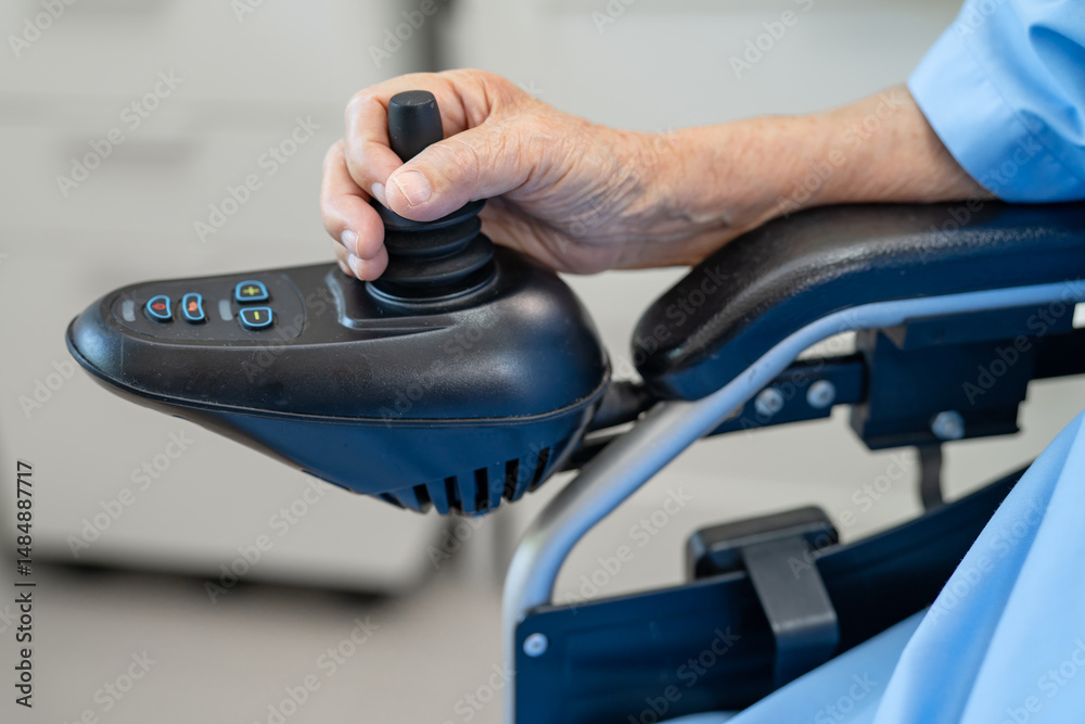 Fototapeta premium Asian senior woman patient on electric wheelchair with remote control at hospital, healthy strong medical.