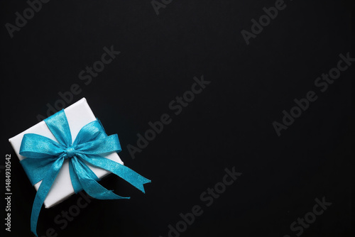 blue tie and a white gift box on a black background22