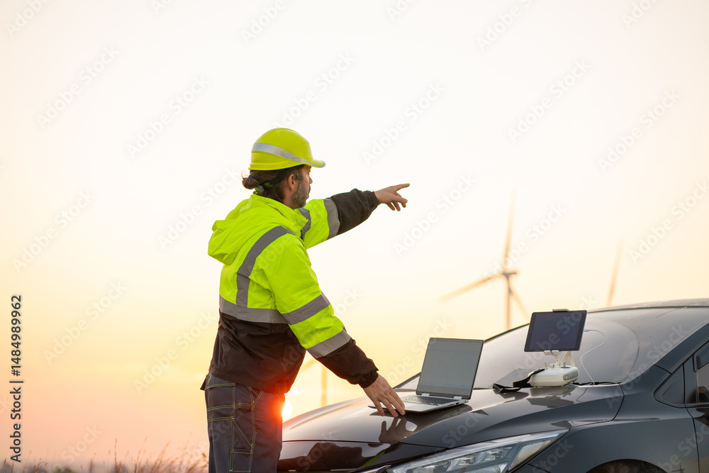 custom made wallpaper toronto digitalEngineer wearing uniform inspection and survey work in wind turbine farms rotation to generate electricity energy. Maintenance engineer working in wind turbine farm at sunset.