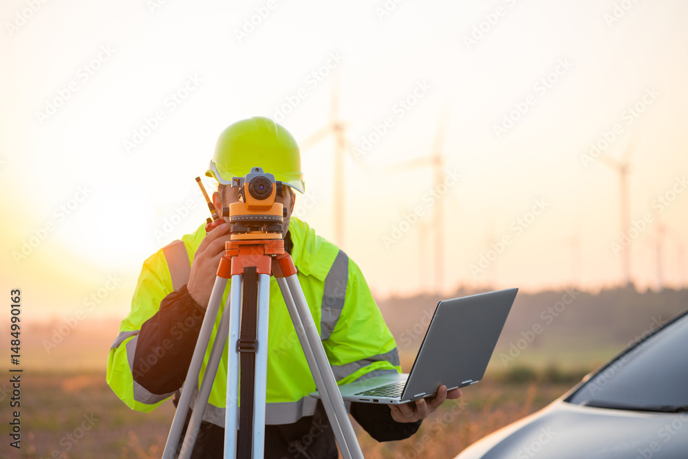custom made wallpaper toronto digitalEngineer wearing uniform inspection and survey work in wind turbine farms rotation to generate electricity energy. Maintenance engineer working in wind turbine farm at sunset.