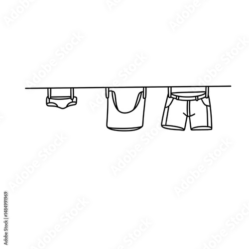 Three pieces of clothing are hanging on a clothesline