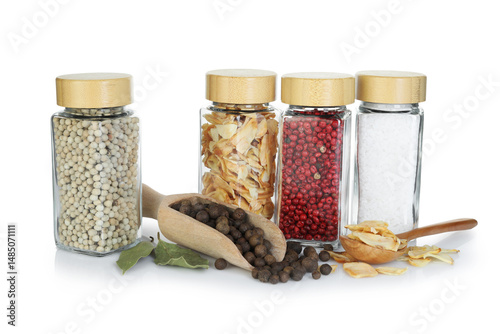 Fototapeta Naklejka Na Ścianę i Meble -  Many different aromatic spices in jars isolated on white