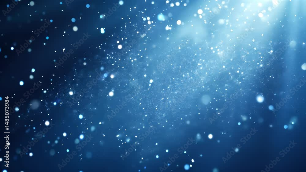 abstract blue background with floating shiny bokeh particles and glowing light rays