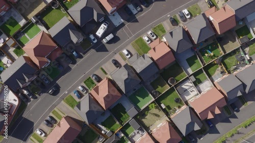 Top down aerial view of new build suburban houses in the United Kingdom. Housing market and suburban lifestyle concept.