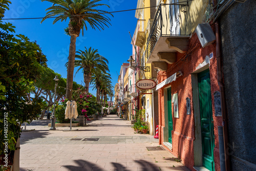 Street view in the town of Carloforte on San Pietro Island with sign Bistrot, Sardinia, Italy