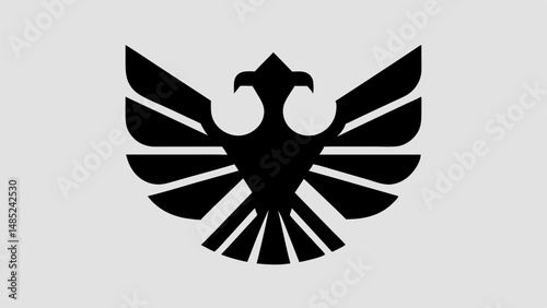 Stylized black eagle with spread wings and geometric design on a light gray background image asset
