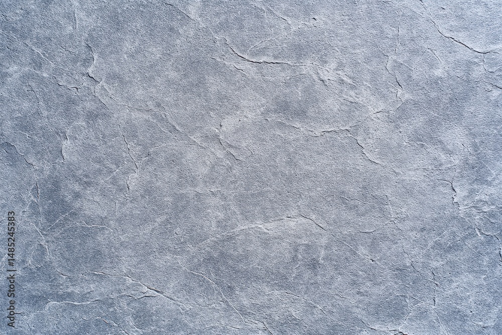 Naklejka premium Light gray stone texture with natural cracks and subtle patterns, ideal for backgrounds or architectural surfaces.