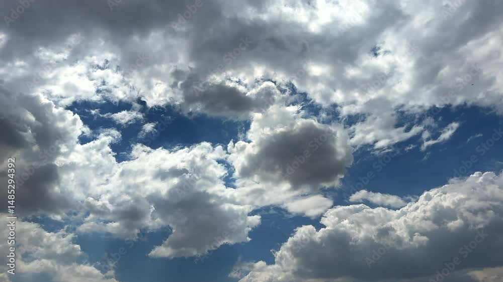 Magical view of cumulus clouds in blue sky. Natural view of white clouds in stunning blue sky. Perfect background for natural concepts. puffy cumulus cloud relaxation weather Summer time. Magical view of cumulus clouds in blue sky. Natural view of white clouds in stunning blue sky. Perfect background for natural concepts. puffy cumulus cloud relaxation weather Summer time.