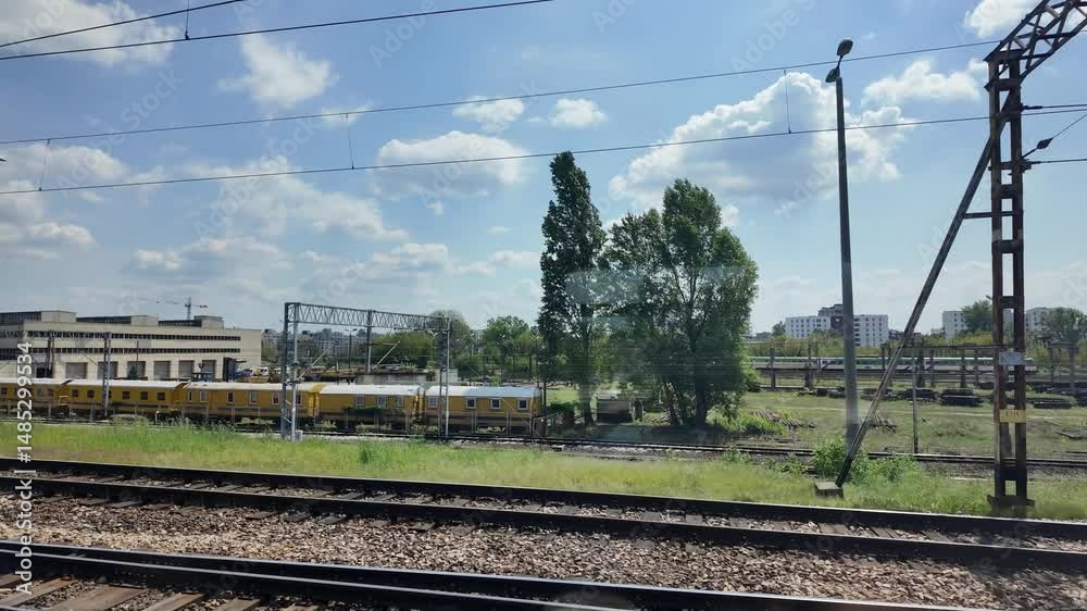 View from window of a train arriving on a East Warsaw railway station, Warsaw city, Poland