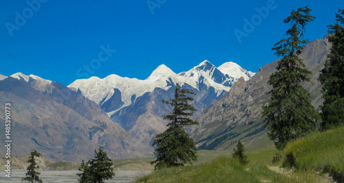 Tian Shan mountains snow peaks and steep slopes in Kazakhstan and Kyrgyzstan border with China. South Inylchek glacier, Enilchek Khan Tengri and Pobeda Victory peak base camp in Pamir mountain range