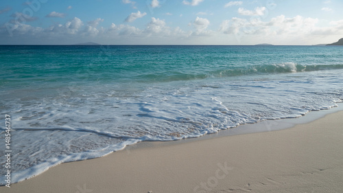 Crystal Clear Ocean Waves Hitting White Sandy Beach