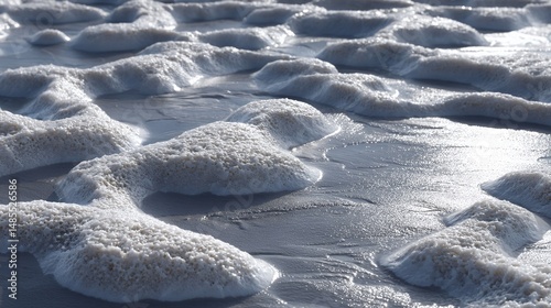 mudflat in wetland with shiny surface and faint water lines