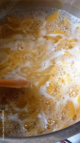 Wallpaper Mural Cooking pasta in the boiling water and food cooking on the kitchen Torontodigital.ca
