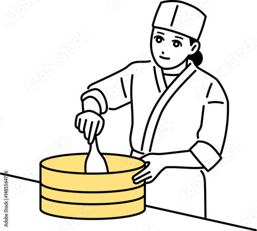 木の桶に入ったごはんを混ぜる寿司屋の女性料理人