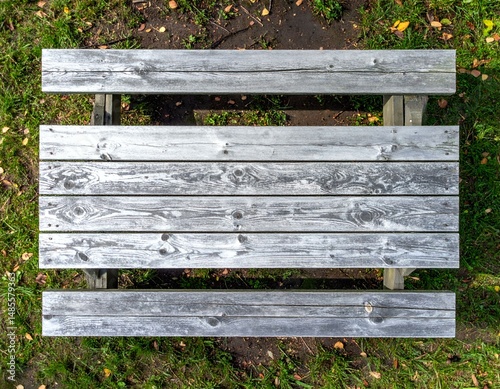 Wallpaper Mural Overhead view of rustic wooden picnic table in grassy park. Ideal for backgrounds, textures, or outdoor themes. Torontodigital.ca