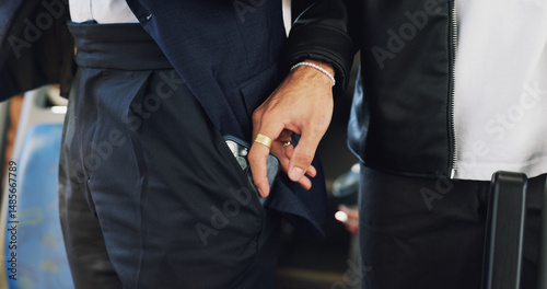 People, hands and thief with pickpocket in bus for corruption, illegal activity or sneaky robbery. Closeup, passenger and theft with phone in public transport or vehicle for fraud, crime or stealing