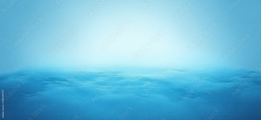 Fototapeta premium calm and misty ocean surface under soft blue light with gentle waves fading into smooth horizon