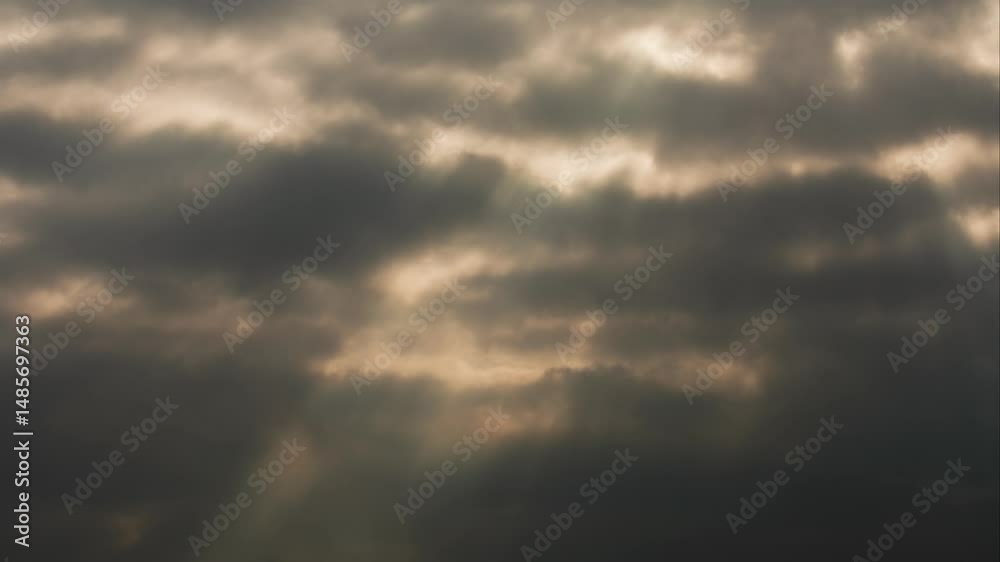 Drifting clouds illuminate the sky with striking light at sunset Drifting clouds illuminate the sky with striking light at sunset